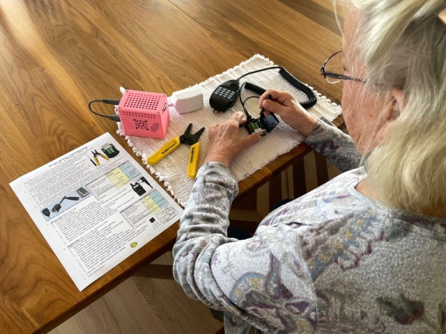Grandmother following directions making a node